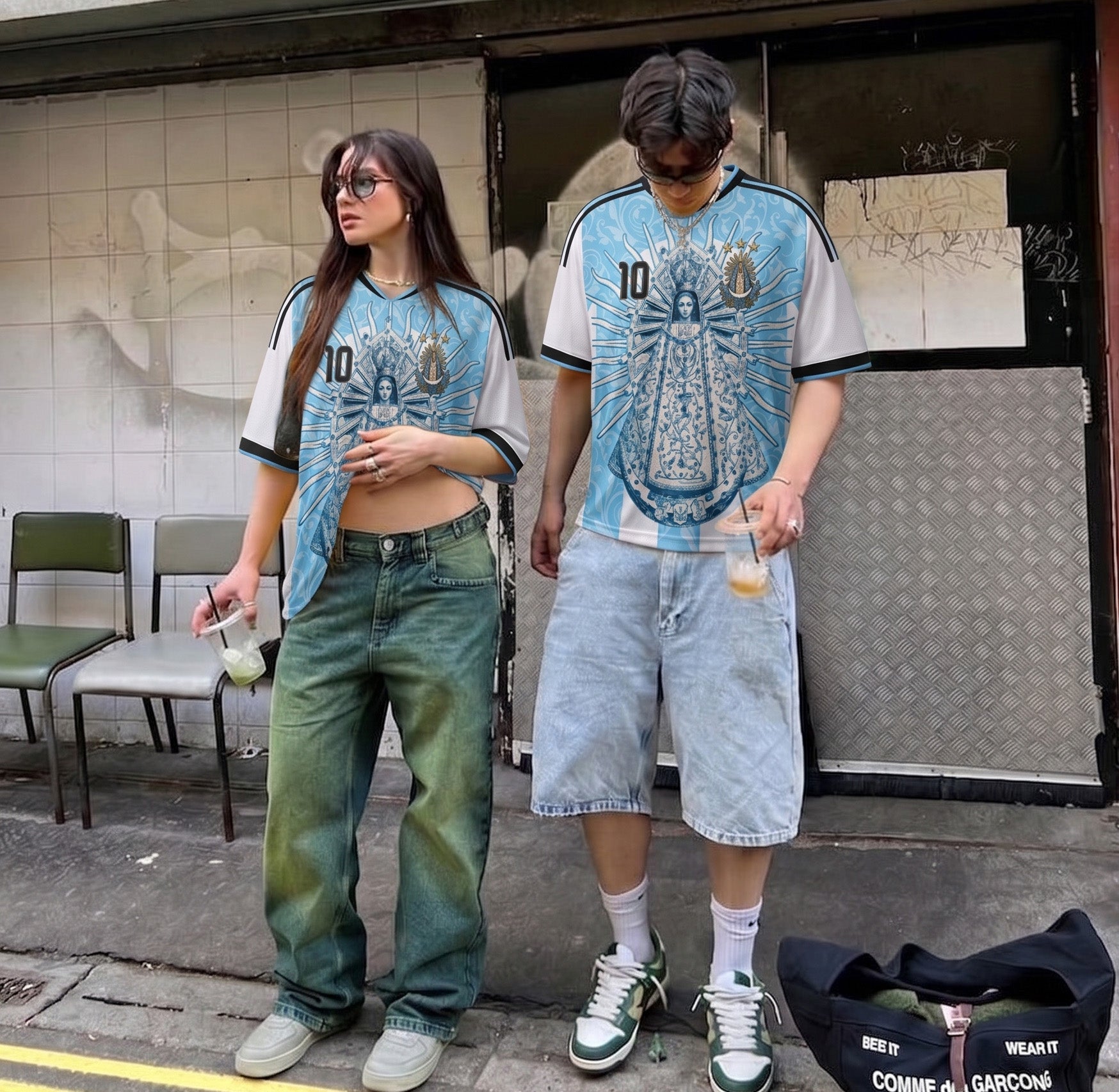 Model wearing Varldens Argentina soccer jersey with Virgen de Luján and Fileteado Porteño art - Blue and white striped heritage shirt