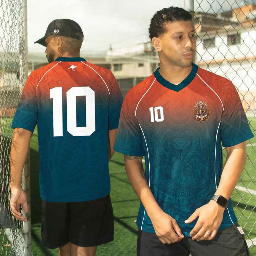 Front and back view of Australia 2026 away jersey in orange and teal gradient with Rainbow Serpent motifs
