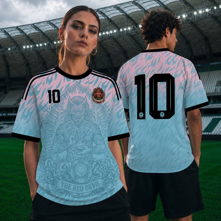 Front and back view of Belgium 2026 away jersey in pink and blue gradient with The Red Devil and sublimated flame motifs