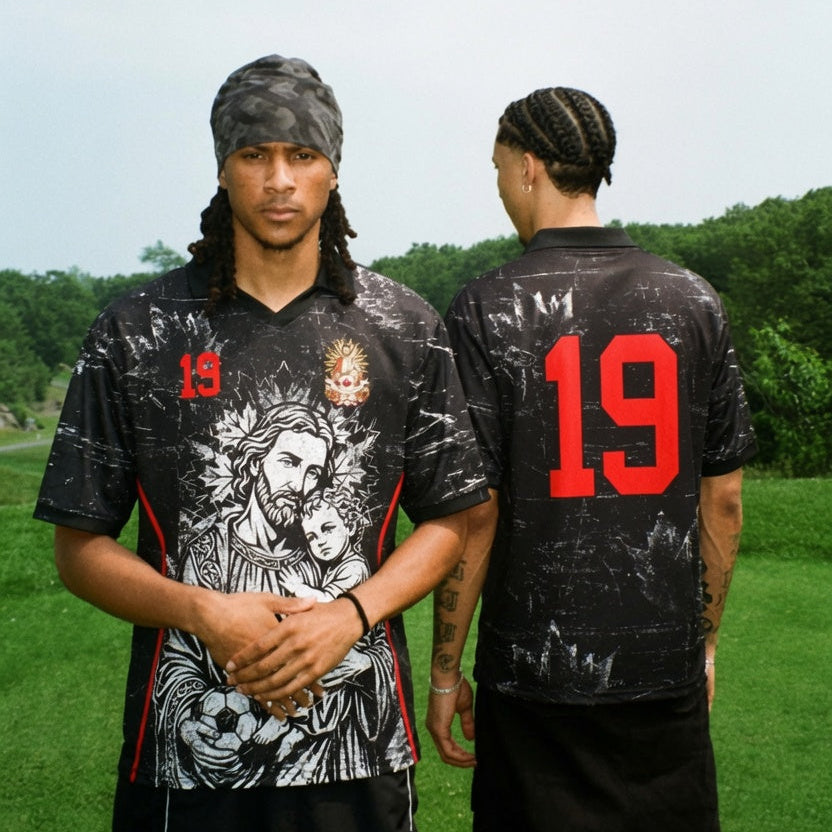 Front and back view of Canada 2026 away jersey in black with Saint Joseph and distressed grunge maple leaf motifs