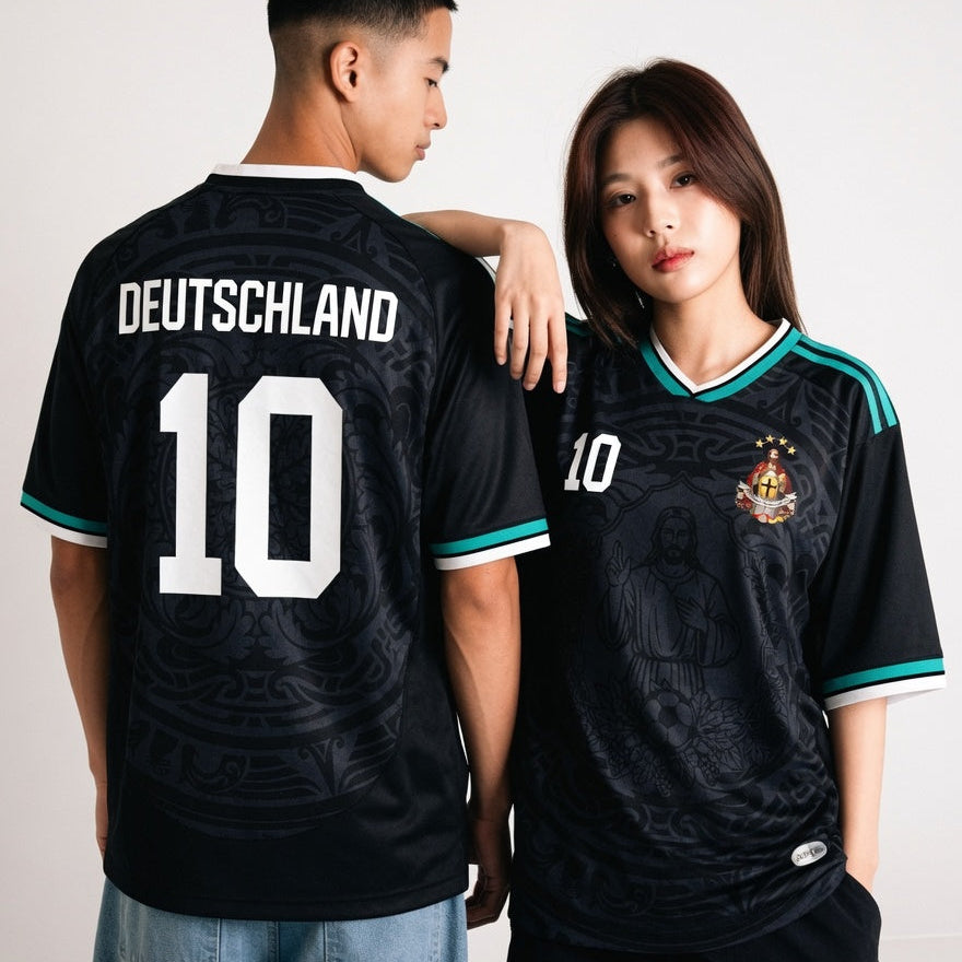 Front and back view of Germany 2026 away jersey in midnight navy with Jesus Christ graphics and teal striped trims