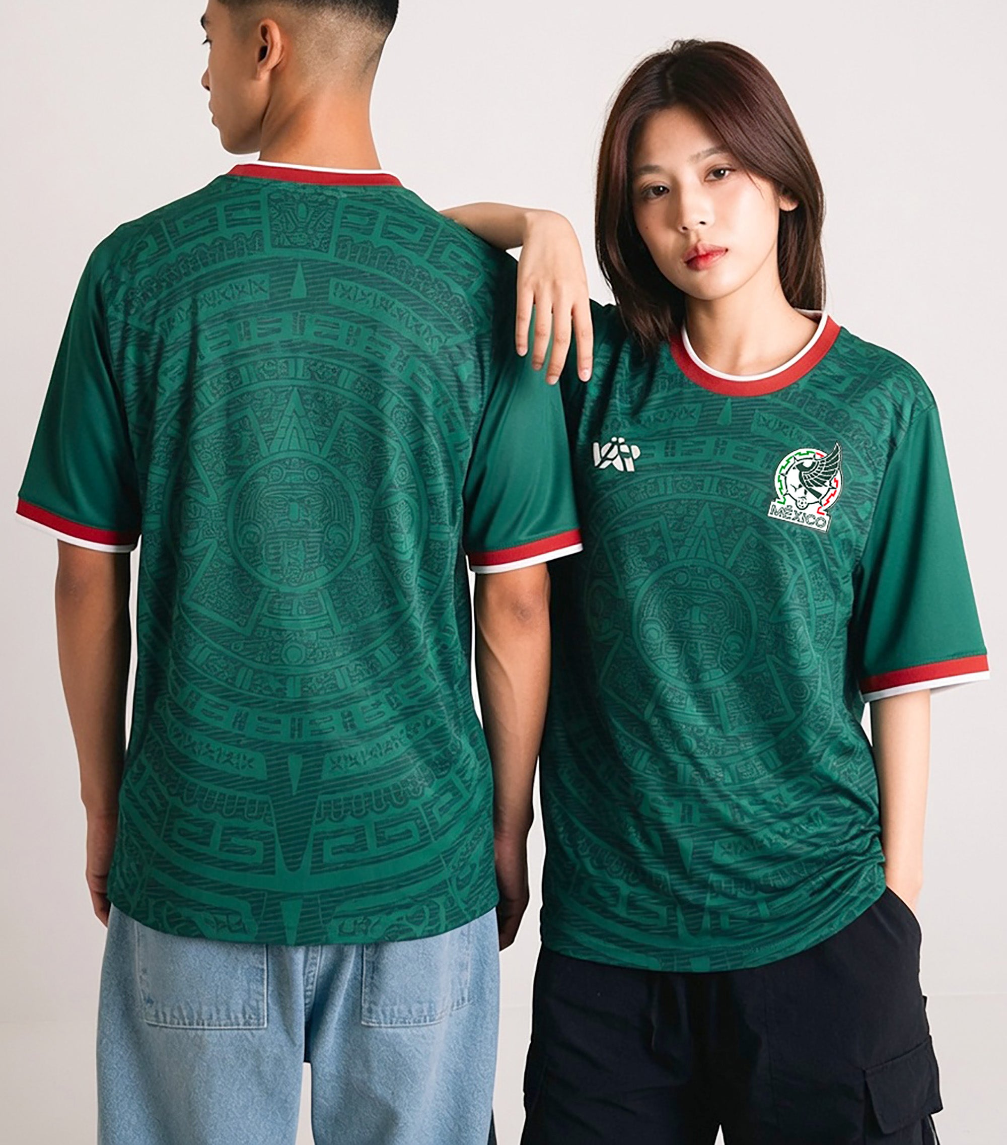 Front and back view of Mexico 2026 home jersey in emerald green with intricate Aztec calendar stone patterns