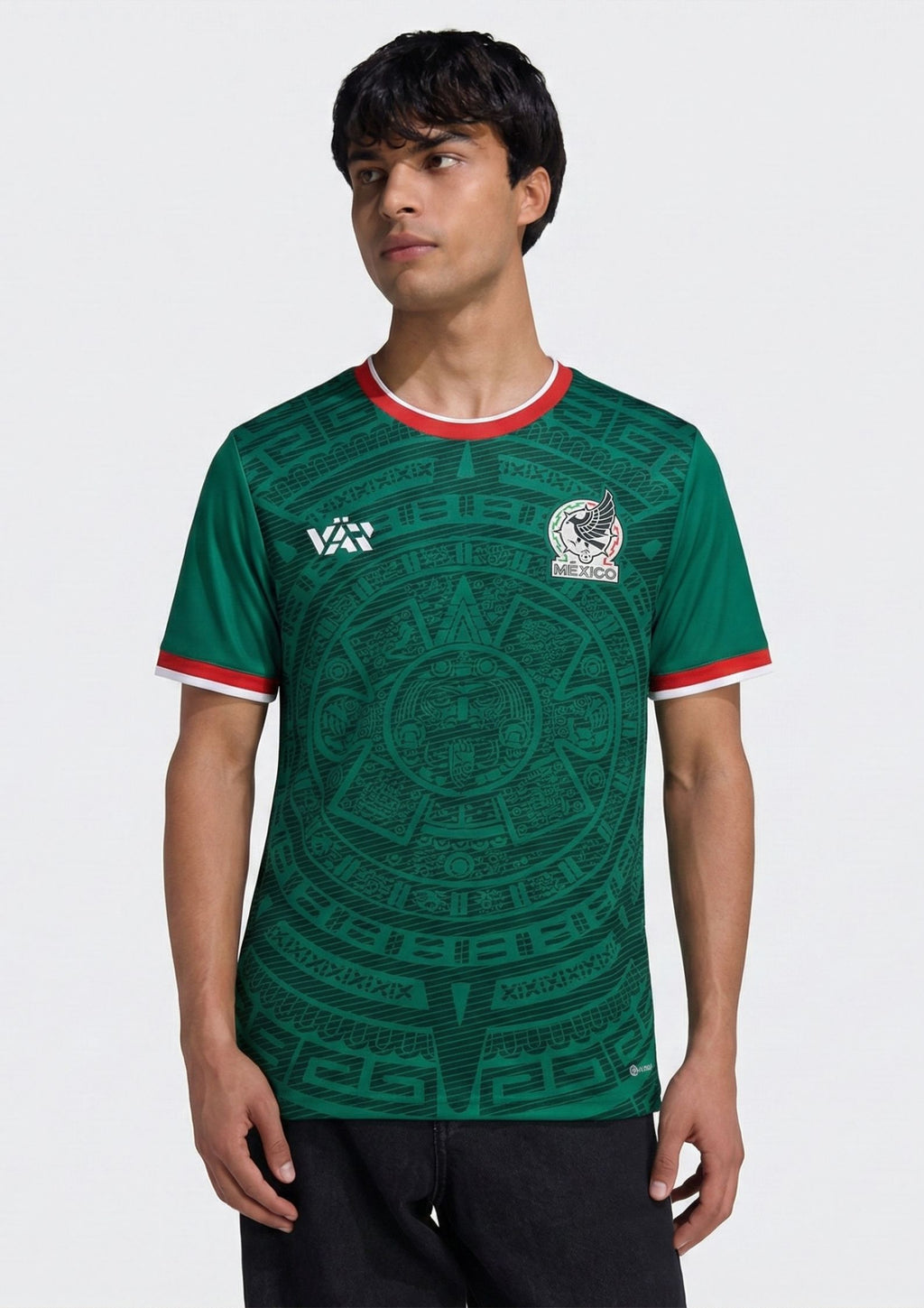 Front and back view of Mexico 2026 home jersey in emerald green with intricate Aztec calendar stone patterns