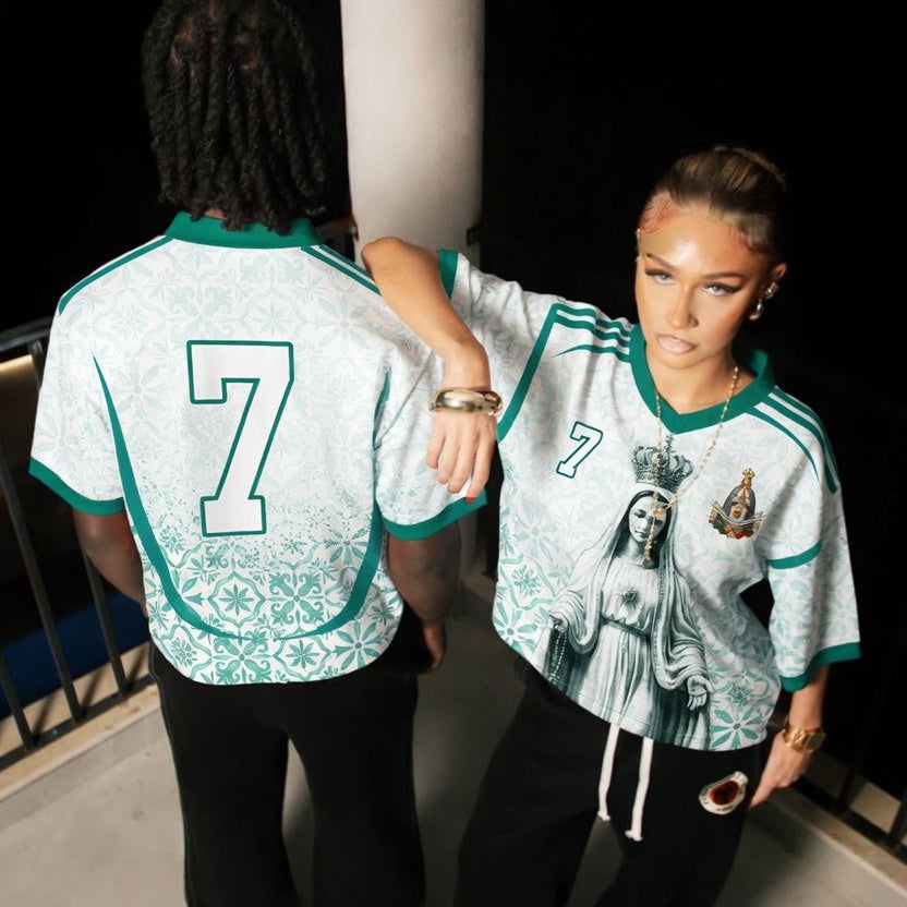 Front and back view of Portugal 2026 away jersey in white and teal with Our Lady of Fatima and Azulejos tile motifs