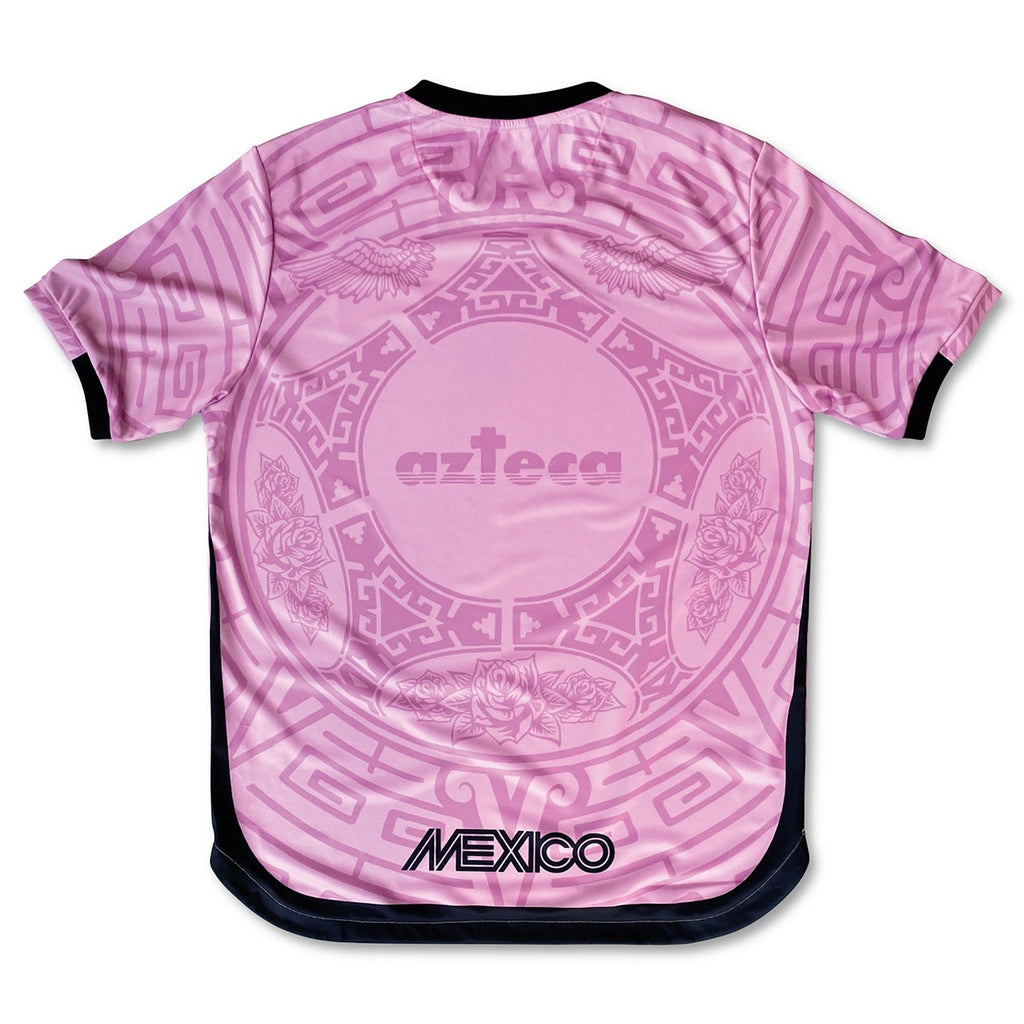 Man styling Varldens pink Mexico football shirt with Our Lady of Guadalupe art and azteca back print for a Blokecore streetwear look
